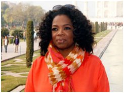 Oprah Winfrey in a white-orange-brown scarf